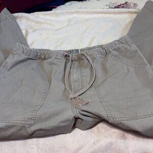 Draw string pants, cotton, big pockets, loose fitting and very comfortable.